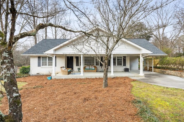 view of front of property with a carport and a porch