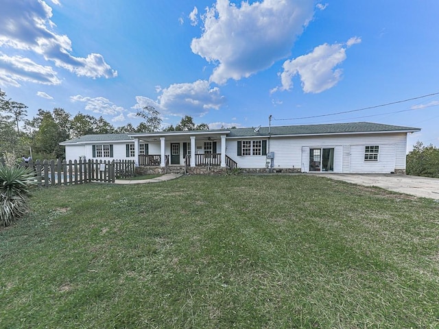 single story home with a porch and a front yard