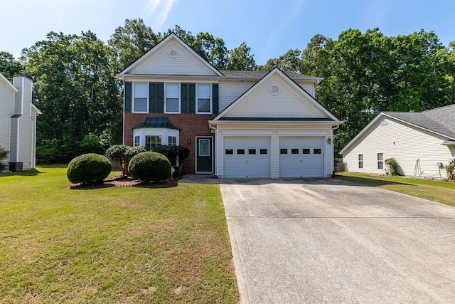 traditional-style house featuring a front yard, brick siding, driveway, and an attached garage