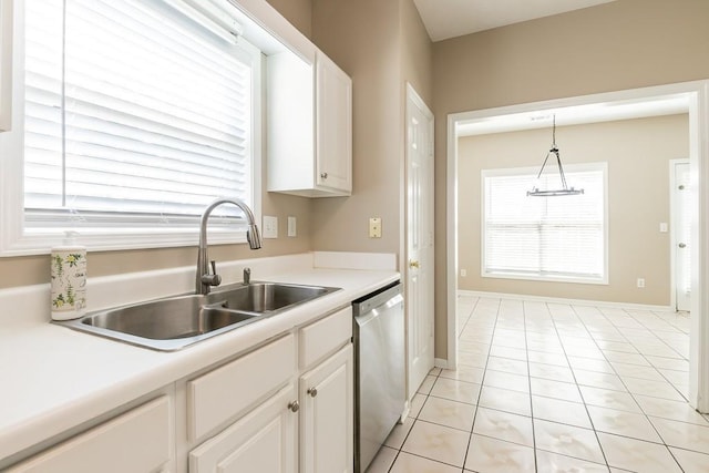 kitchen featuring a sink, white cabinetry, light countertops, and dishwasher