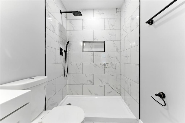124 Sims Dr, Hiram, GA 30141 - bathroom featuring toilet, tiled shower, and vanity
