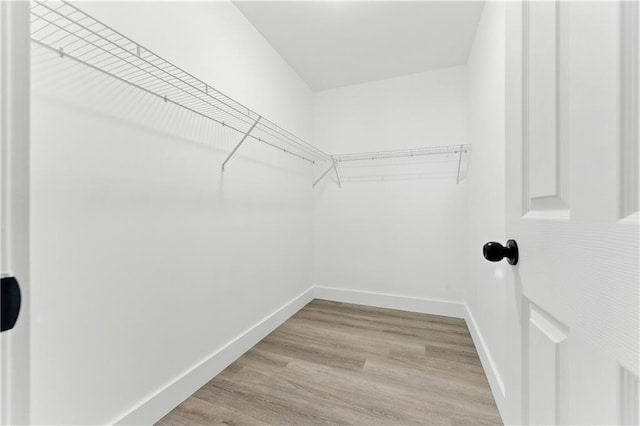 124 Sims Dr, Hiram, GA 30141 - walk in closet with wood finished floors