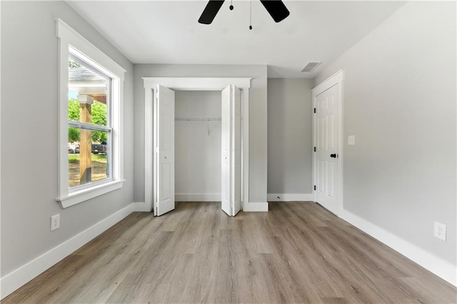 124 Sims Dr, Hiram, GA 30141 - unfurnished bedroom with light wood-style flooring, baseboards, a closet, and ceiling fan