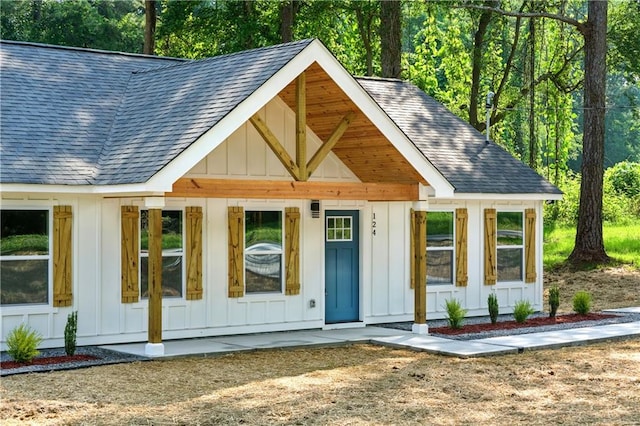 124 Sims Dr, Hiram, GA 30141 - view of front of house with board and batten siding and a shingled roof