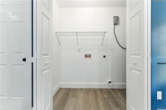 124 Sims Dr, Hiram, GA 30141 - laundry room with electric dryer hookup, wood finished floors, washer hookup, and baseboards