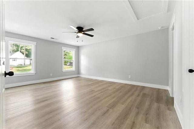 124 Sims Dr, Hiram, GA 30141 - unfurnished room with light wood-type flooring, attic access, baseboards, and a ceiling fan