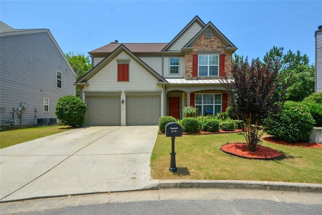 574 Friars Head Dr, Suwanee, GA 30024 - view of front of property with concrete driveway, a front lawn, a standing seam roof, and a metal roof