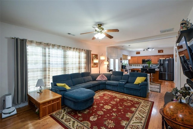 574 Friars Head Dr, Suwanee, GA 30024 - living room featuring ceiling fan and light wood-style flooring