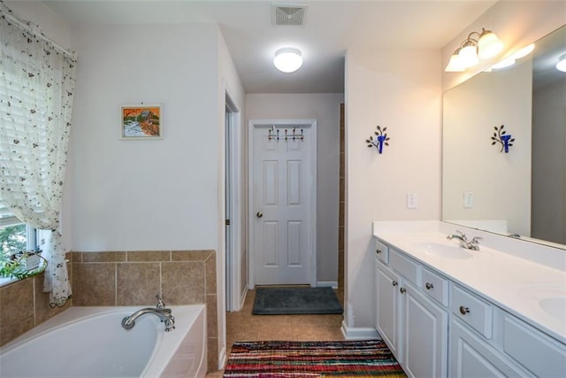 574 Friars Head Dr, Suwanee, GA 30024 - bathroom featuring double vanity, a garden tub, and tile patterned flooring