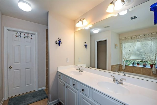 574 Friars Head Dr, Suwanee, GA 30024 - bathroom featuring double vanity and a tub to relax in