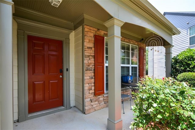 574 Friars Head Dr, Suwanee, GA 30024 - entrance to property featuring covered porch, stone siding, and brick siding
