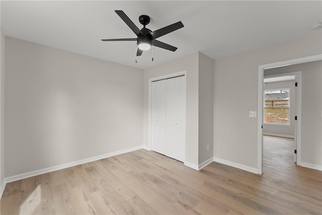 unfurnished bedroom featuring a closet, ceiling fan, and light hardwood / wood-style flooring