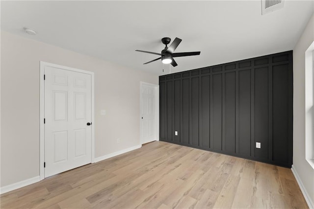 unfurnished bedroom featuring ceiling fan and light hardwood / wood-style floors