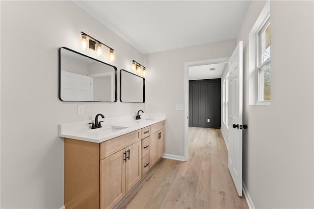 bathroom with vanity and hardwood / wood-style floors