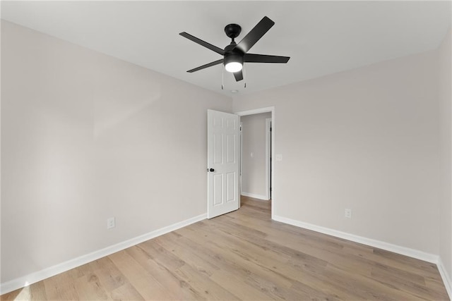 spare room with light hardwood / wood-style flooring and ceiling fan