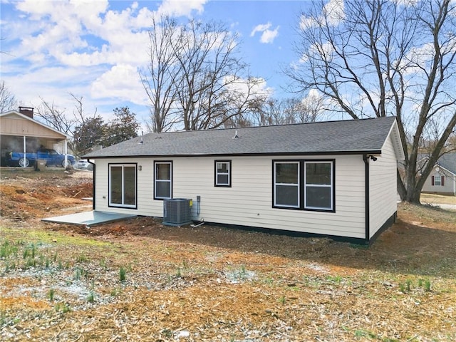 back of house featuring a patio area and central air condition unit