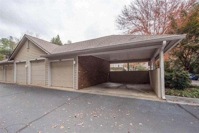 exterior space with a carport