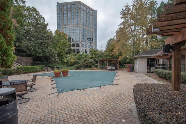 view of swimming pool with a pergola and a patio area