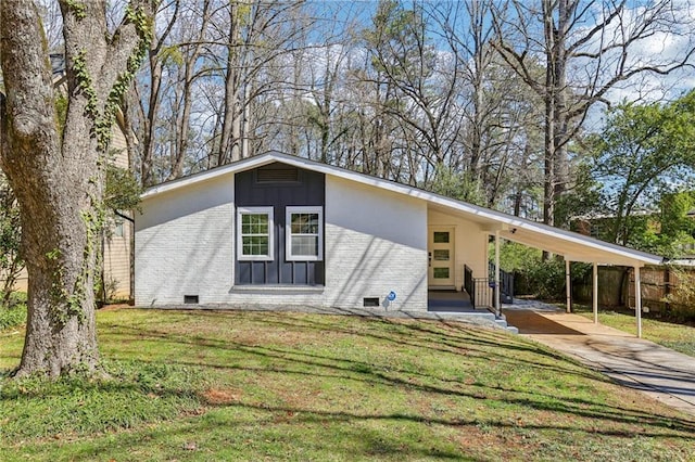 mid-century modern home featuring brick siding, board and batten siding, crawl space, an attached carport, and driveway