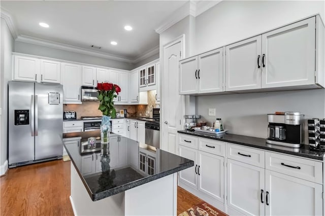 2300 Peachford Rd Unit 1410, Atlanta, GA 30338 - kitchen with white cabinets, light wood-type flooring, a center island, and stainless steel appliances