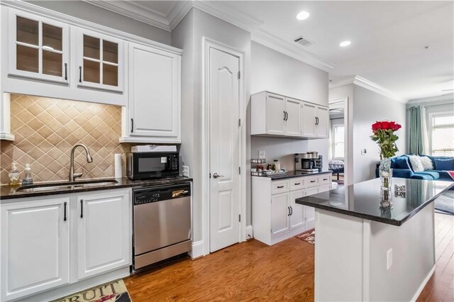 2300 Peachford Rd Unit 1410, Atlanta, GA 30338 - kitchen featuring crown molding, white cabinetry, light hardwood / wood-style flooring, stainless steel dishwasher, and sink