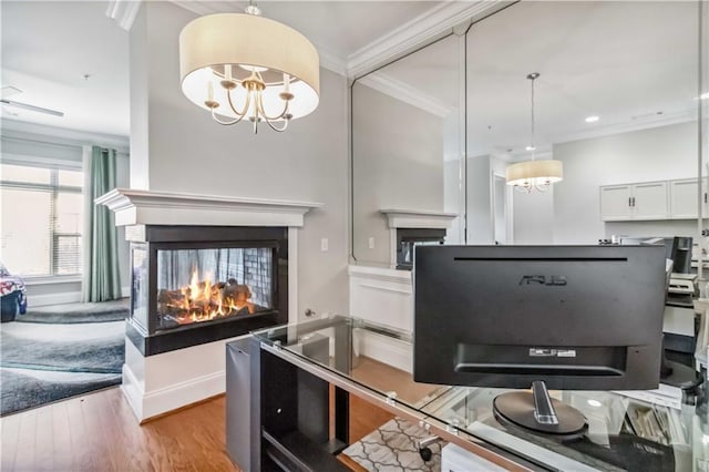 2300 Peachford Rd Unit 1410, Atlanta, GA 30338 - kitchen featuring ornamental molding, white cabinetry, a multi sided fireplace, and a notable chandelier