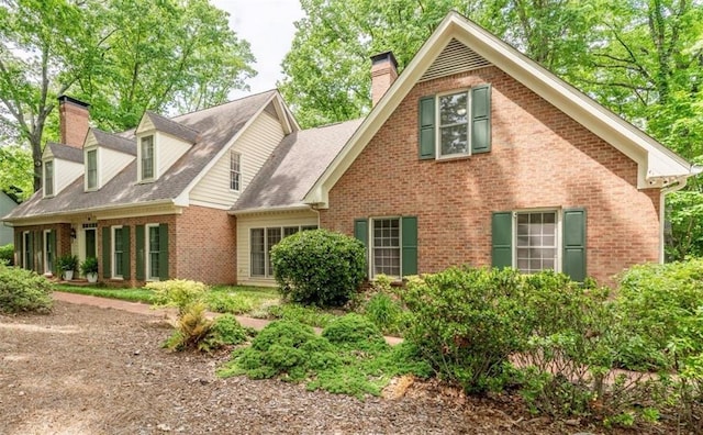 335 Cameron Ridge Dr, Atlanta, GA 30328 - rear view of property featuring brick siding and a chimney