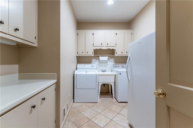 335 Cameron Ridge Dr, Atlanta, GA 30328 - laundry area with washer and dryer, light tile patterned flooring, and cabinet space