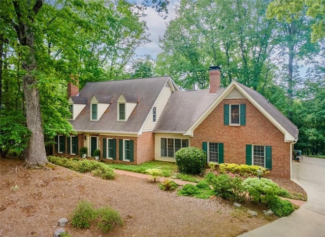 335 Cameron Ridge Dr, Atlanta, GA 30328 - cape cod home with a chimney and brick siding