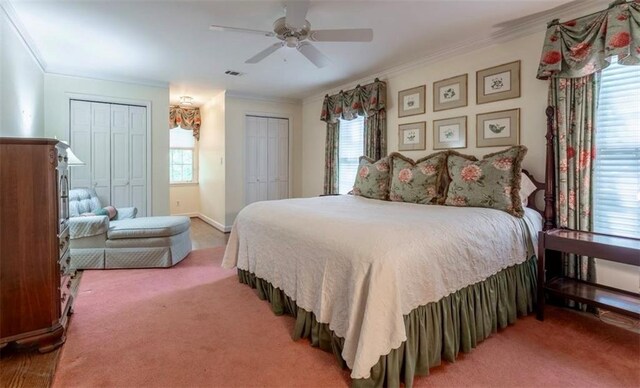 335 Cameron Ridge Dr, Atlanta, GA 30328 - bedroom with ornamental molding, multiple windows, a ceiling fan, and multiple closets