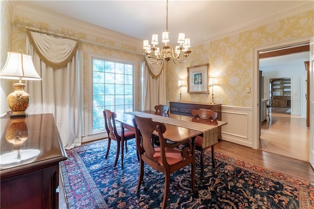 335 Cameron Ridge Dr, Atlanta, GA 30328 - dining space with an inviting chandelier, wood finished floors, wallpapered walls, a wainscoted wall, and crown molding