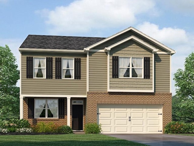 view of front of house featuring a front lawn and a garage