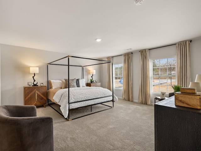 bedroom featuring light colored carpet