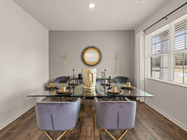 dining space featuring dark hardwood / wood-style flooring