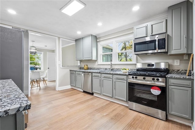 1623 Athens Ave SW, Atlanta, GA 30310 - kitchen with a sink, ornamental molding, gray cabinetry, and stainless steel appliances