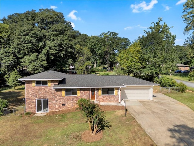 view of front of house with a garage and a front yard