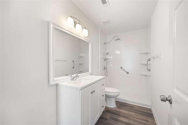 3645 Ten Oaks Cir, Powder Springs, GA 30127 - bathroom with toilet, a shower, wood finished floors, vanity, and baseboards