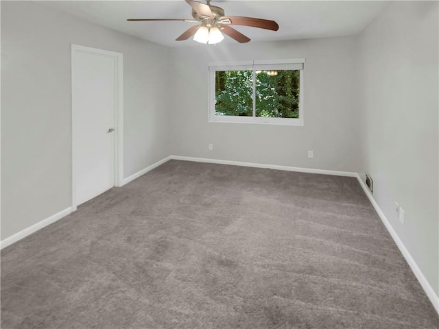 unfurnished room featuring carpet and ceiling fan