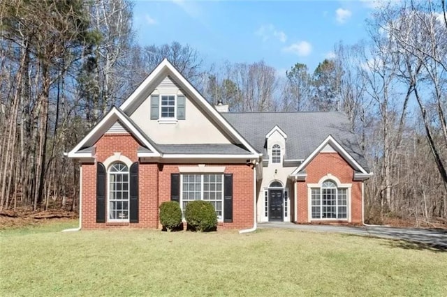 4021 Melvin Dr SW, Atlanta, GA 30331 - traditional home with brick siding, a front yard, and stucco siding