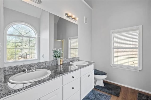 4021 Melvin Dr SW, Atlanta, GA 30331 - full bath featuring double vanity, a shower with door, and wood finished floors