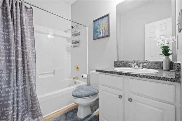 4021 Melvin Dr SW, Atlanta, GA 30331 - full bathroom with vanity, shower / bathtub combination with curtain, and wood finished floors