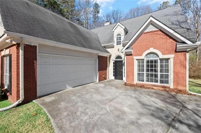 4021 Melvin Dr SW, Atlanta, GA 30331 - traditional home with concrete driveway, brick siding, and an attached garage