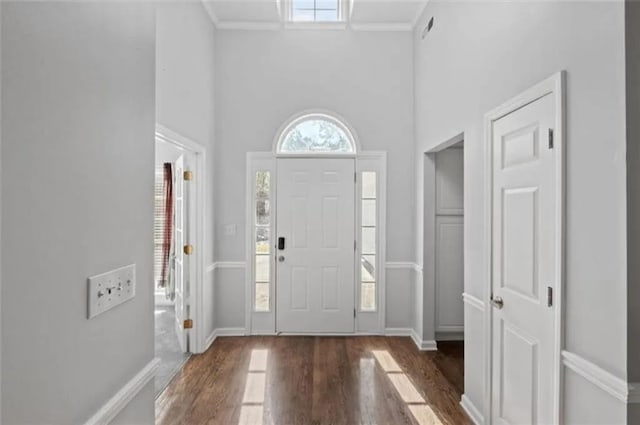 4021 Melvin Dr SW, Atlanta, GA 30331 - foyer entrance featuring wood finished floors, a towering ceiling, and ornamental molding
