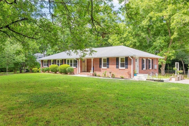 ranch-style home with a front lawn