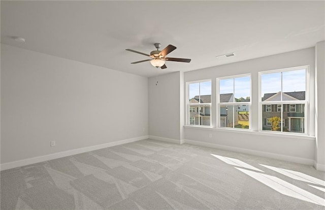 empty room with light carpet and ceiling fan