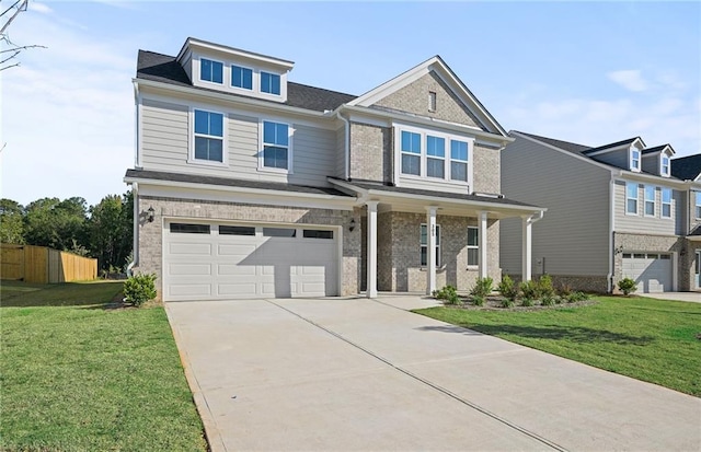 view of front of home featuring a garage and a front lawn