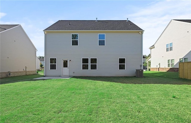 back of property featuring cooling unit, a yard, and a patio