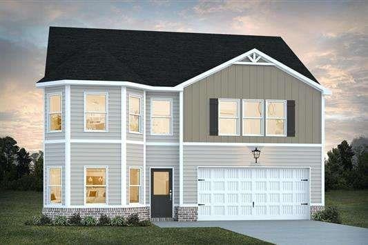 317 Lusitano Trce, Hogansville, GA 30230 - view of front facade featuring an attached garage, board and batten siding, and driveway