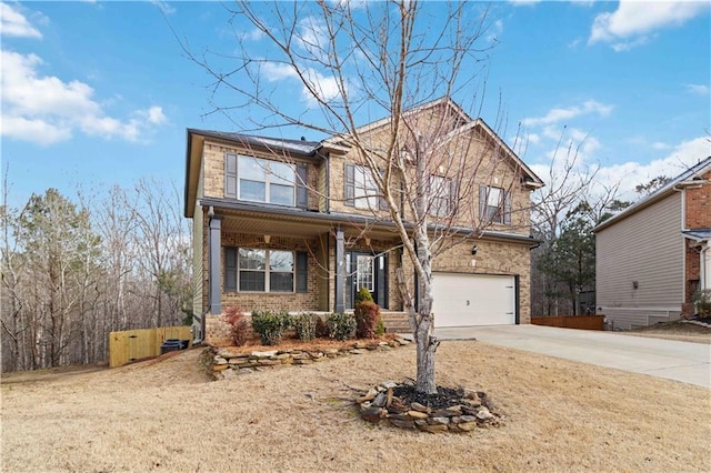 view of front property featuring a garage and a porch