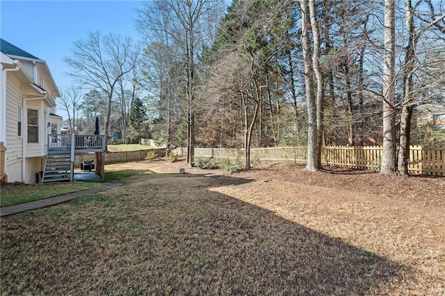 view of yard featuring a wooden deck